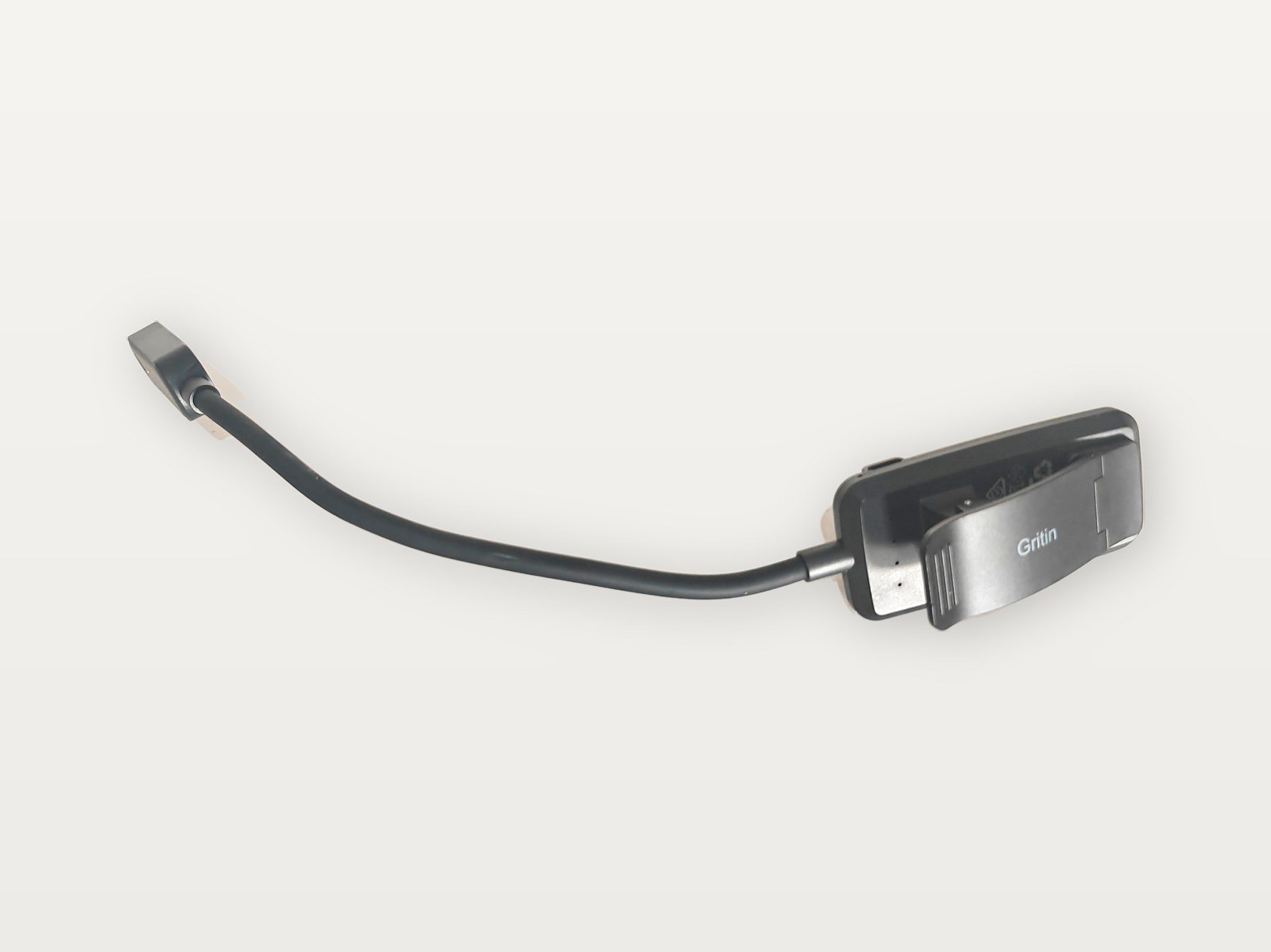 La pinza de mi luz de lectura Gritin, con el logo de la marca